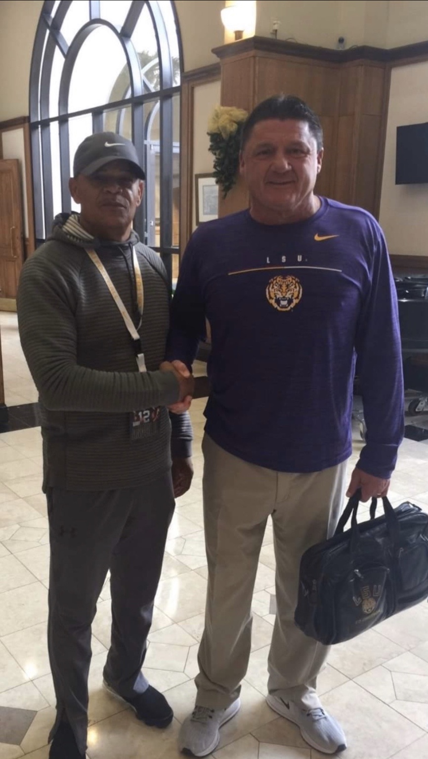 Nations Elite founder pictured with an LSU football coach